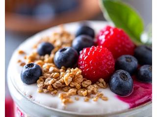 A close-up of a vibrant bowl of probiotics-rich food like yogurt with berries and granola, showcasing healthy gut nutrition.