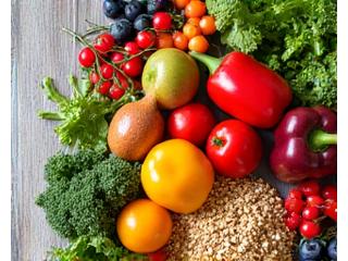An array of fresh, vibrant plant-based ingredients like colorful vegetables, fruits, and grains artfully arranged, representing wholesome plant-based nutrition.
